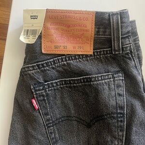Levi’s black cut off 501s